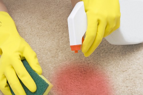 Professional carpets cleaner in W6 removing dirt from a living room carpet
